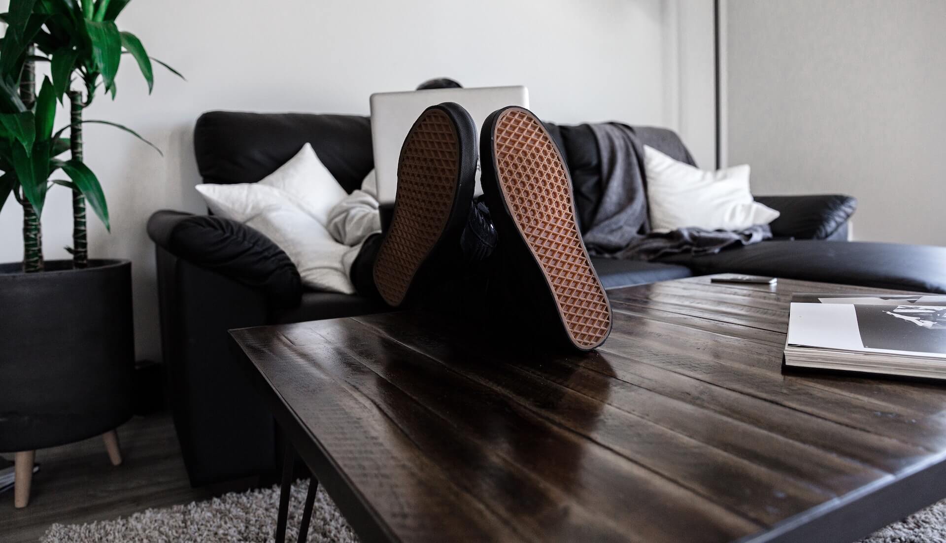 Sitting on the couch with feet on the coffee table